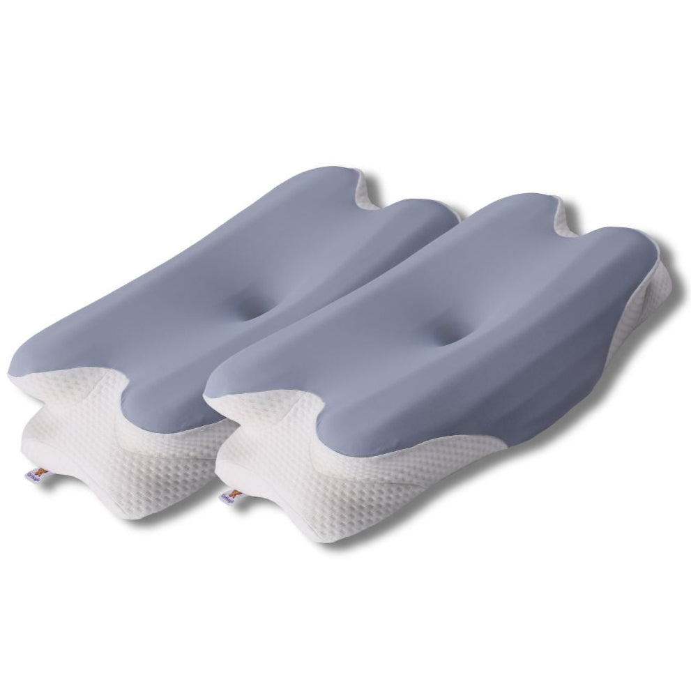 Three gray and white pillows on a white background